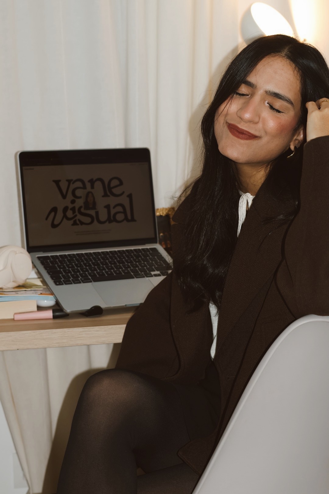 Portrait of the blog owner with face partially distorted through two clear glasses of water on a white table